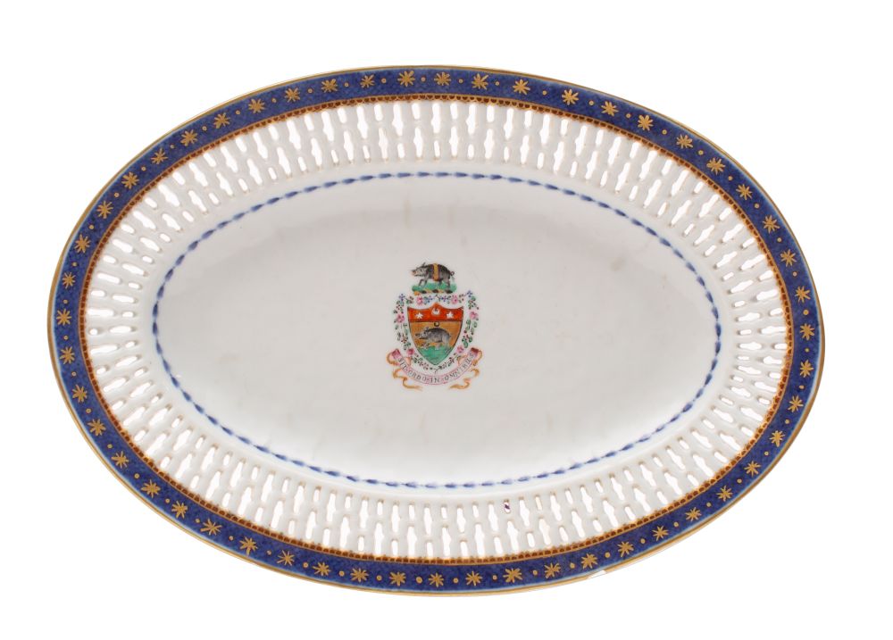 A Chinese famille rose armorial pierced oval dish painted with the arms for Tessier of a boar