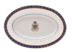 A Chinese famille rose armorial pierced oval dish painted with the arms for Tessier of a boar