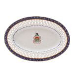 A Chinese famille rose armorial pierced oval dish painted with the arms for Tessier of a boar