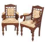 A pair of Anglo Indian or Burmese carved hardwood open elbow chairs,