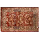 A Turkish mat with an ivory ground geometric design compartmented field, 138cm x 58cm,