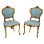 A pair of carved and giltwood and upholstered side chairs in Louis XV style,