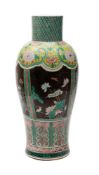 A large Chinese famille noire vase decorated with panels and bands of prunus,
