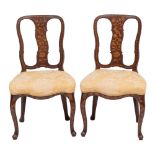 A pair of Dutch walnut and marquetry side chairs,