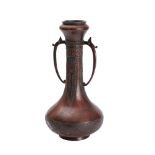 A Chinese bronze two handled vase of ovoid form with slender neck,