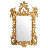 A carved and giltwood framed wall mirror in late George II Rococo style,