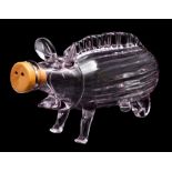 A novelty pale amethyst glass flask in the form of a wild boar with ribbed flanks and tooled