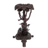 A central European, probably 'Black Forest' carved and stained wood jardiniere stand,