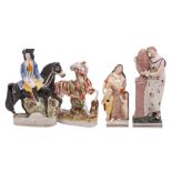 A group of four Staffordshire pottery figures comprising two early 19th century pearlware square