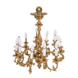 A gilt metal twelve-branch chandelier, the central column with waisted floral decorated stem,