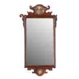 A parcel gilt framed walnut wall mirror in George I taste,