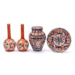 A small group of Japanese porcelain comprising an Imari oviform jar and cover,
