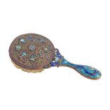 A Chinese cloisonne hairbrush, the waisted handle decorated with a dragon to either side,