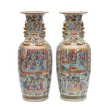 A pair of Chinese Canton famille rose baluster vases applied with gilt chilong and lion dog handles,