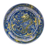 A Chinese underglaze blue and yellow 'Dragon' saucer dish,