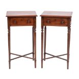 A pair of mahogany bedside tables in Regency style,