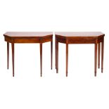 A matched pair of George III mahogany and line inlaid card tables,