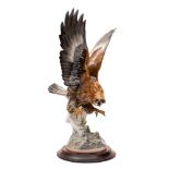 A large Hutschenreuther porcelain figure of an eagle modelled by Karl Tutter with wings and claws