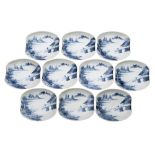 A set of ten Japanese blue and white shaped dishes each painted with a lake landscape with a figure