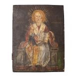 A late 19th century Greek icon depicting a seated Saint Nicholas giving a blessing whilst holding a