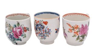 A group of three 18th century English coffee cups comprising a Lowestoft Curtis pattern cup,