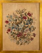 A 19th century needlework panel depicting a floral spray, worked in coloured silks of reds, greens,