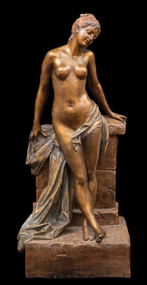 A large Goldscheider Art Nouveau bronzed earthenware figure in the form of a semi-naked girl