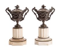 A pair of 19th century bronze vases and covers of urn-shaped outline,