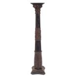 A Victorian carved and ebonised wood columnar pedestal, possibly Irish,