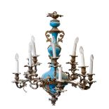 A late 19th century French gilt metal and blue glass mounted twelve branch chandelier in rococo