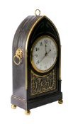An ebonised Georgian mantel clock having an eight-day duration single-fusee timepiece movement,
