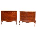 A pair of kingwood parquetry and marble topped serpentine front commodes in late Louis XV