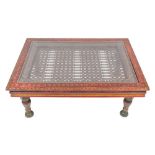 An Indian carved and painted wood and wrought iron mounted low table, 20th century,