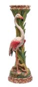 A Delphin Massier majolica 'flamingo' jardiniere stand in the form of a flamingo standing amongst