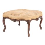 A carved and stained mahogany and embroidery upholstered centre stool in Louis XV style,