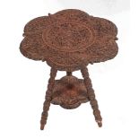 A south east Asian, probably Anglo Burmese carved and stained hardwood occasional table,