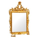 A pair of carved and giltwood framed wall mirrors in Louis XIV style,