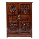 A Chinese carved and stained hardwood side cupboard,