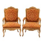 A pair of carved and giltwood and upholstered fauteuils in Louis XV taste,