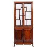 A Chinese stained hardwood display cabinet,