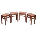 A set of four Chinese hardwood, probably huanghuali occasional or urn tables,