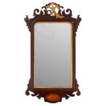 A mahogany and parcel gilt framed wall mirror in George I style,