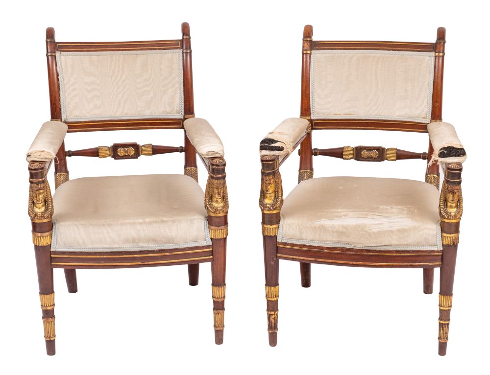 A pair of fine late Empire or Restauration mahogany and parcel gilt fauteuils,