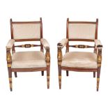 A pair of fine late Empire or Restauration mahogany and parcel gilt fauteuils,