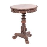 An Anglo Indian carved and stained hardwood occasional table, Bombay Presidency,