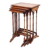 A nest of four walnut quartetto tables in George III style,