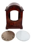 A substantial mahogany bracket clock case and round silvered dial with brass bezel and glass,