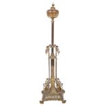 A Victorian brass lamp standard and shade with globe reservoir on a reeded stem and square column