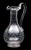 A Stourbridge glass wine ewer in rock crystal style together with one other ewer,