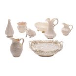 A collection of Belleek porcelains, including an oval three strand basket, an Ivy pattern cream jug,